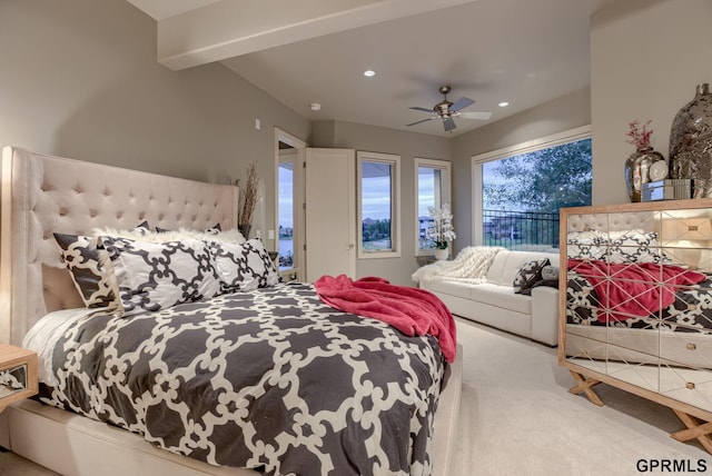 bedroom featuring beam ceiling, carpet floors, and ceiling fan