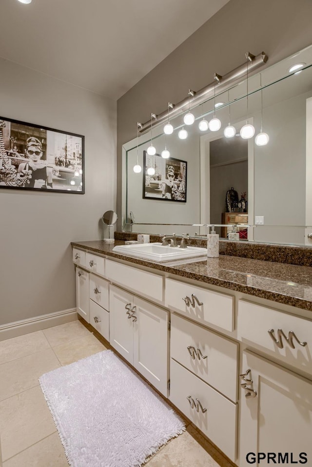 bathroom with tile patterned flooring and vanity