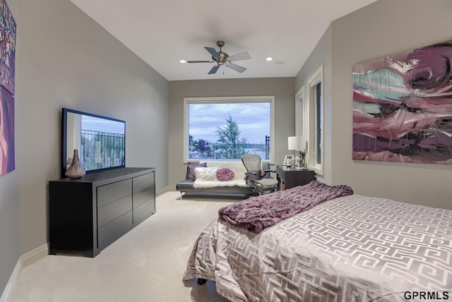 bedroom with ceiling fan and light colored carpet