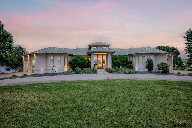 prairie-style house with a yard