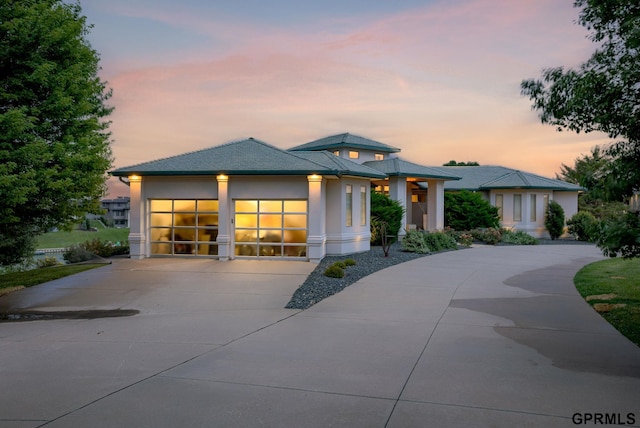 prairie-style home featuring a garage