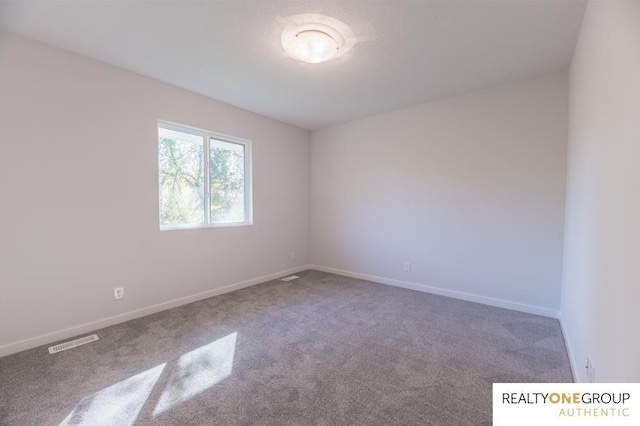 empty room featuring carpet flooring