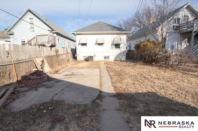 rear view of property featuring a patio area