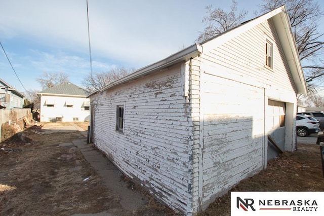 view of side of home with a garage