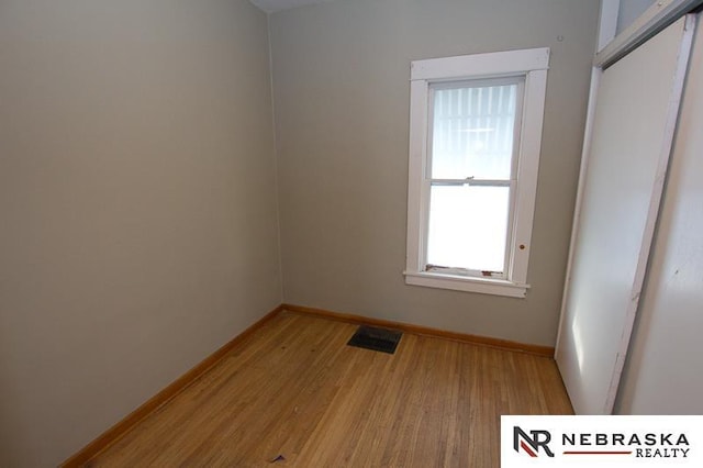 spare room with light hardwood / wood-style floors