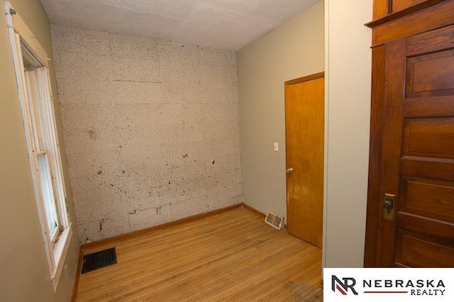 spare room featuring light wood-type flooring