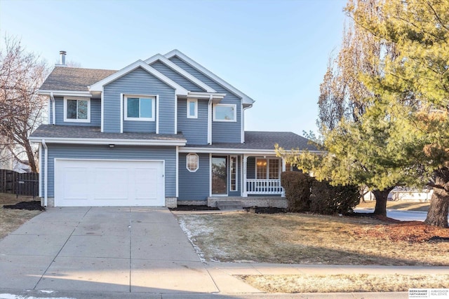 view of front of property with a garage and a porch