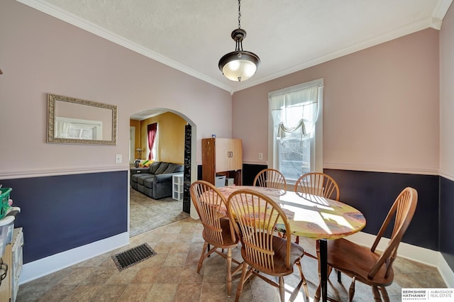 dining area featuring ornamental molding