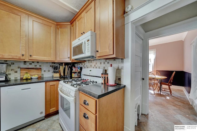 kitchen featuring tasteful backsplash, white appliances, and light brown cabinetry