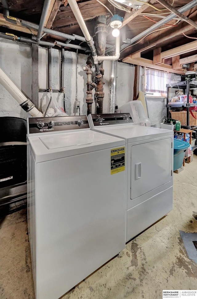 clothes washing area with washer and dryer