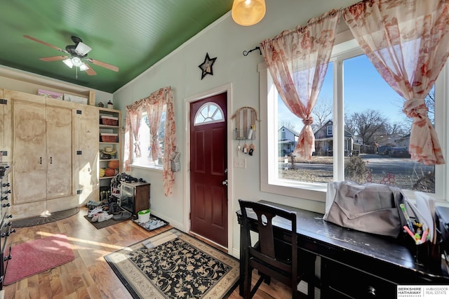 entryway with hardwood / wood-style flooring and ceiling fan