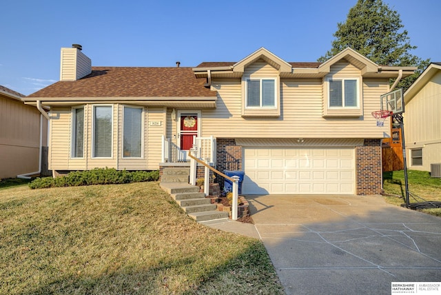 view of front of home with a garage, central air condition unit, and a front lawn