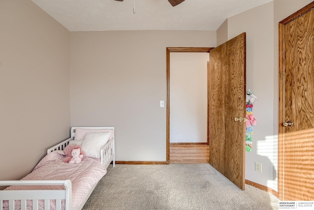 carpeted bedroom with ceiling fan