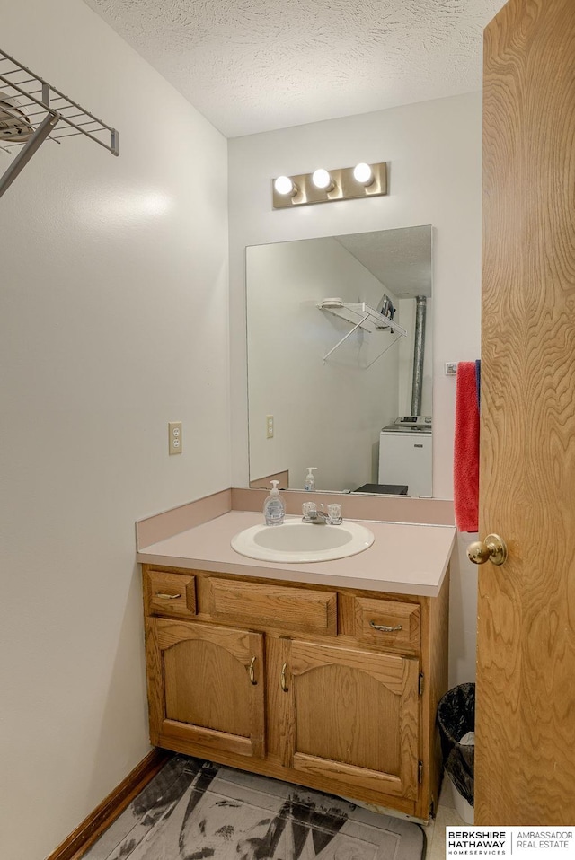 bathroom featuring vanity and a textured ceiling