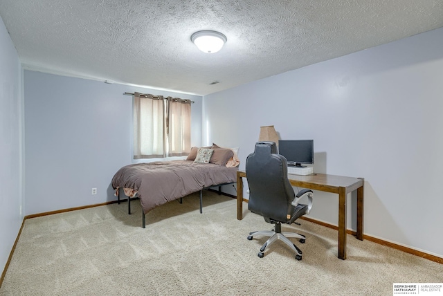 carpeted bedroom featuring a textured ceiling