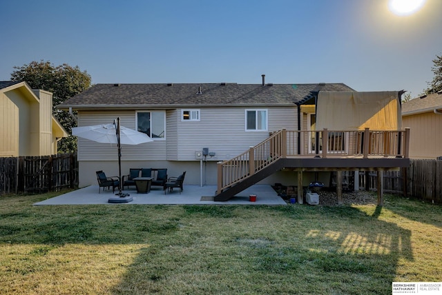 back of house featuring a patio area, a deck, and a lawn