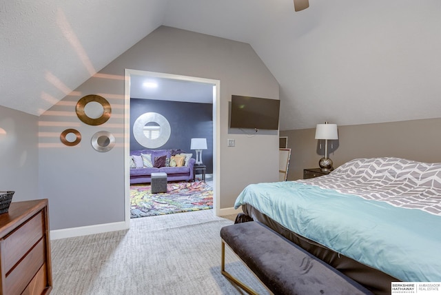 carpeted bedroom featuring vaulted ceiling and ceiling fan