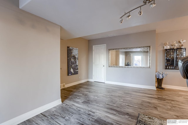 unfurnished living room with hardwood / wood-style flooring