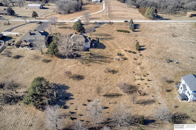 birds eye view of property with a rural view