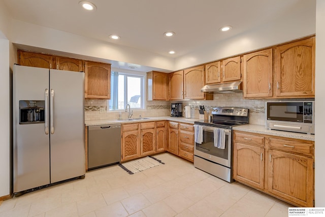 kitchen featuring tasteful backsplash, stainless steel appliances, and sink