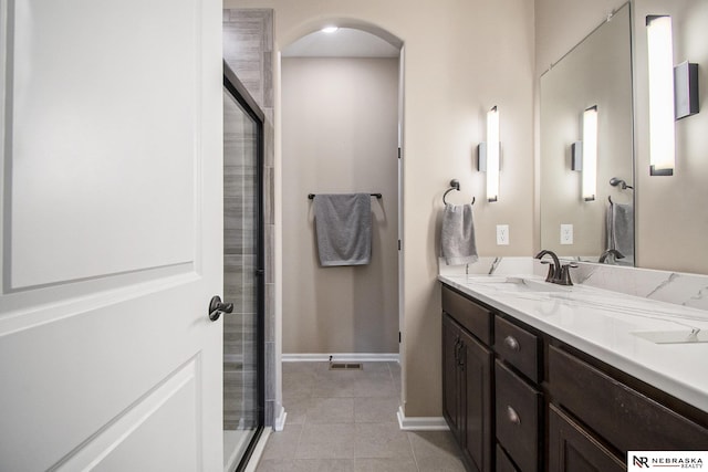 bathroom with vanity and walk in shower