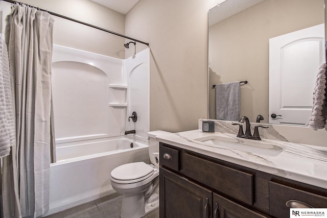 full bathroom with vanity, shower / tub combo with curtain, tile patterned floors, and toilet