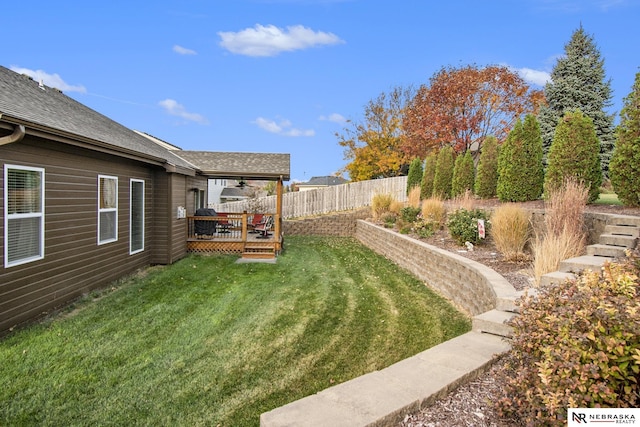 view of yard with a wooden deck