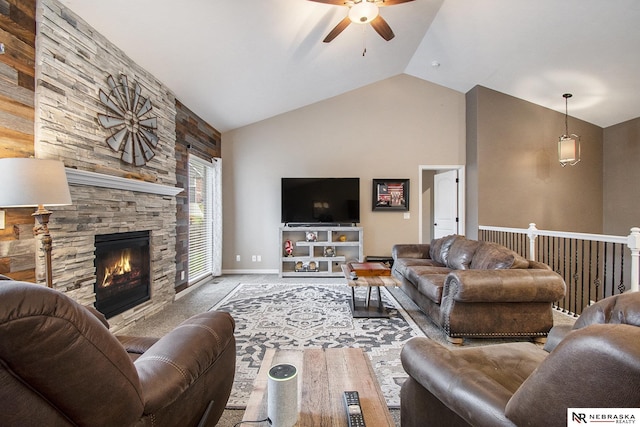 carpeted living room with lofted ceiling, a fireplace, wooden walls, and ceiling fan