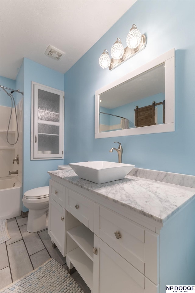 full bathroom with tile patterned flooring, vanity, shower / tub combination, and toilet