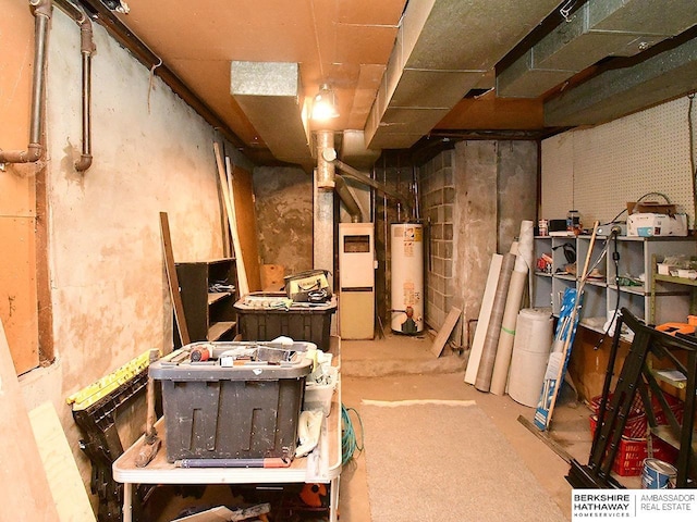 basement featuring heating unit and water heater