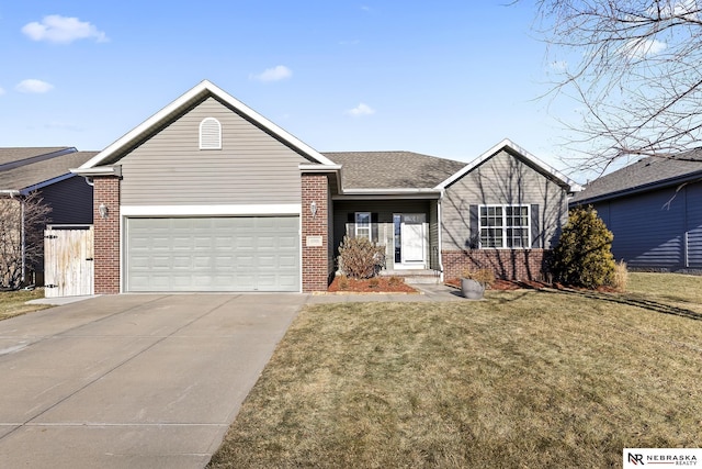 single story home featuring a garage and a front lawn