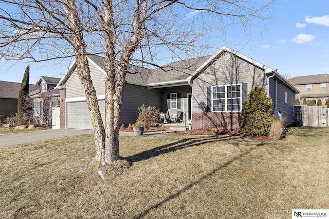 ranch-style home with a garage and a front lawn