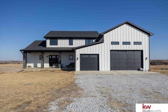 modern farmhouse style home with board and batten siding, driveway, and an attached garage