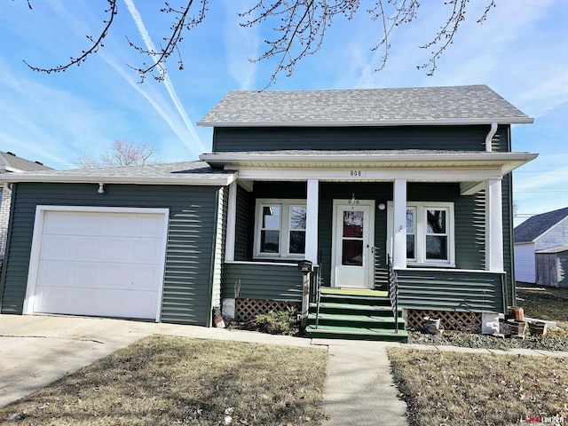 view of front facade featuring a garage, concrete driveway, and roof with shingles