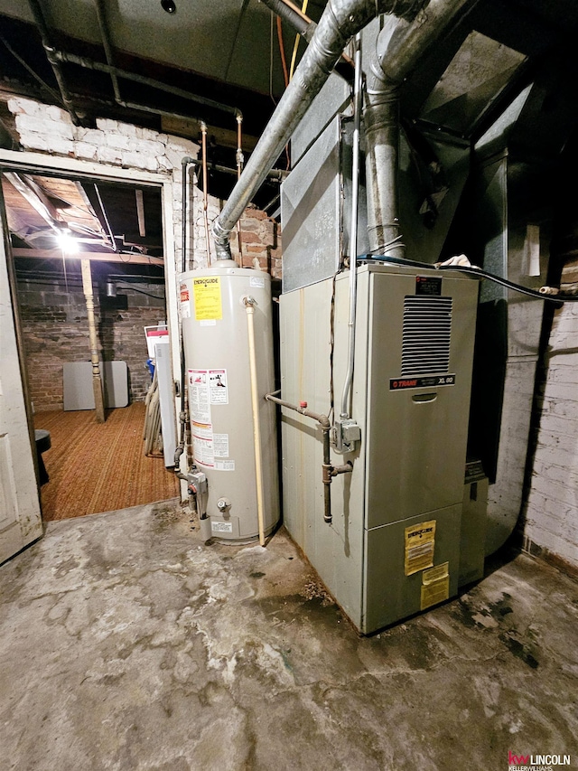 utility room featuring water heater