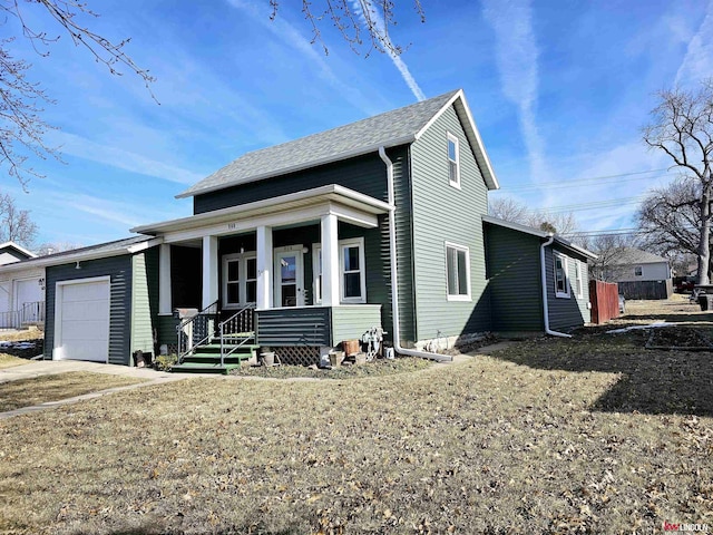 view of front of house with a porch, an attached garage, driveway, roof with shingles, and a front lawn