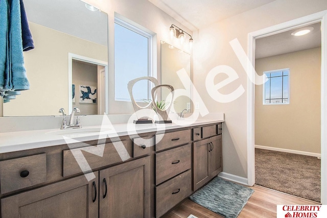 bathroom featuring vanity and hardwood / wood-style floors