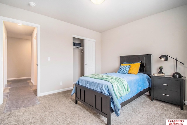 carpeted bedroom with a closet