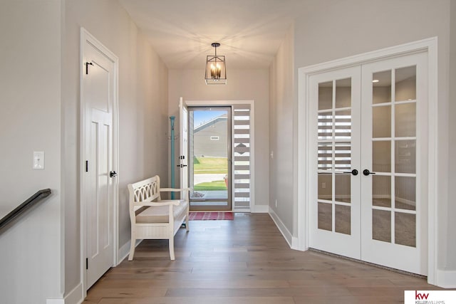 foyer entrance with french doors and wood-type flooring