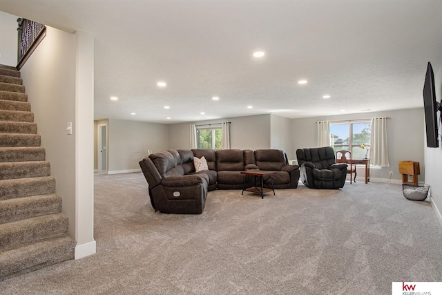 carpeted living room with plenty of natural light