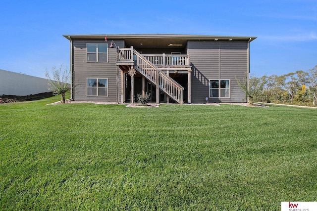 rear view of house with a yard and a deck