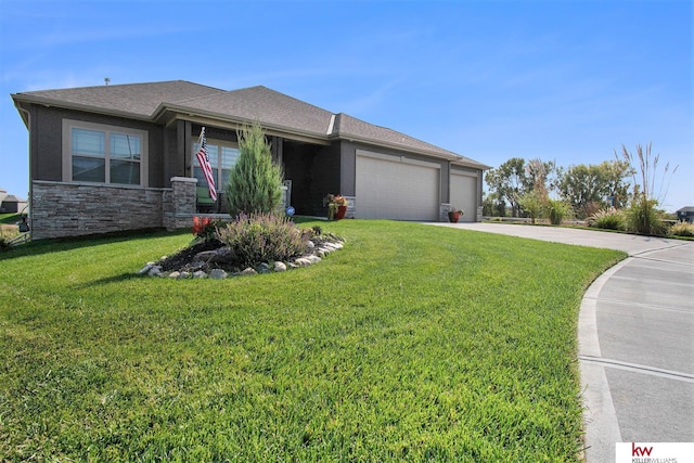 view of front of home featuring a garage and a front yard