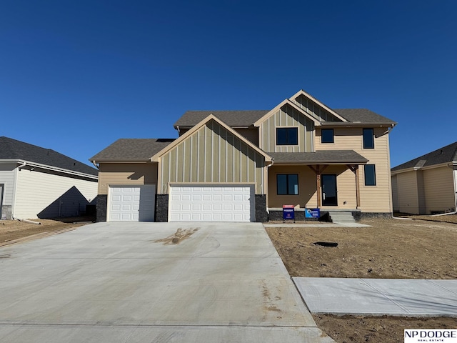 view of front facade featuring a garage and covered porch