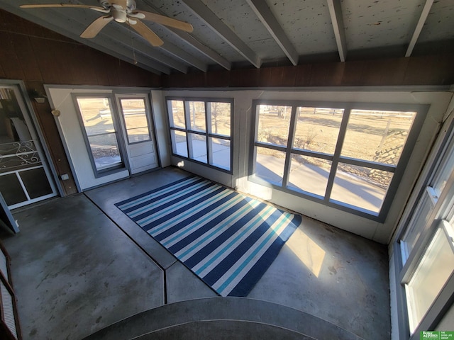 unfurnished sunroom featuring lofted ceiling and ceiling fan