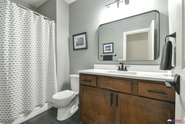 bathroom with tile patterned flooring, vanity, a shower with shower curtain, and toilet