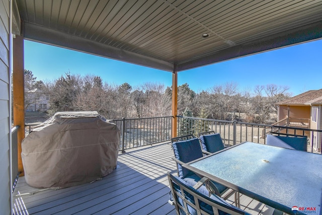 wooden terrace featuring grilling area