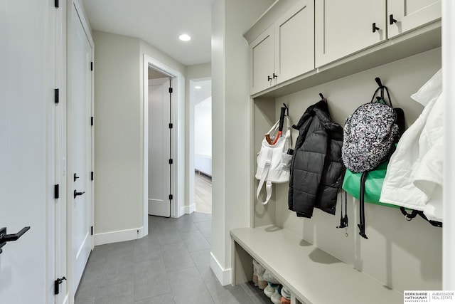 mudroom with light tile patterned floors