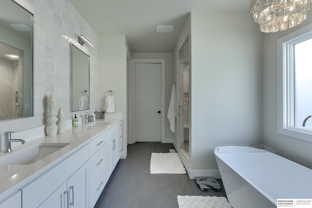 bathroom with vanity, tile patterned floors, and separate shower and tub