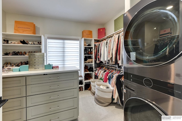 spacious closet featuring light carpet