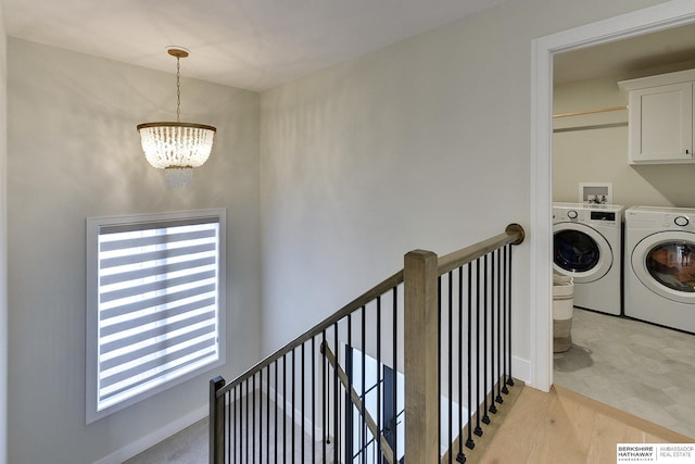 interior space featuring an inviting chandelier and washer and clothes dryer